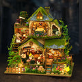 Wooden Forest Hut Miniature Model Kit with Multi-Level Cabin Scene, Lighting Details and Forest Adventures Label — image 1