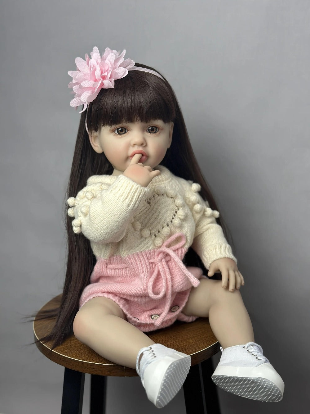 Reborn Baby Doll 22-Inch Full Vinyl Seated Design with Long Dark Wig Hair, Acrylic Eyes and Outfit Set — image 6