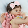 Reborn Doll, Soft-Body Sleeping Figure with Hand-Painted Details, Purple Bows and Floral Outfit — image 1