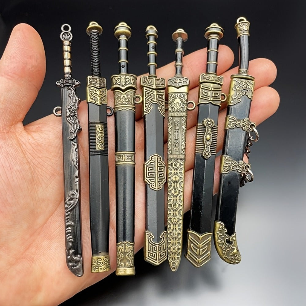 Seven-Piece Miniature Metal Sword Replica Set with Sheaths, Keychains and Ancient-Inspired Display Designs — image 7