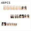 Press On Nails 48-Piece Medium Square Black and White Matte French Tip Butterfly Full-Cover Set — image 1