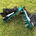 Lawn Aerator Shoe Pair with Green Platforms, Adjustable Black Straps and Spiked Soles for Walking Use — image 1