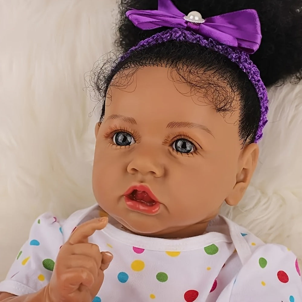Reborn Baby Doll 21.5-Inch Full Vinyl Design with Curly Dark Hair, Open Eyes and Purple-and-White Outfit — image 6