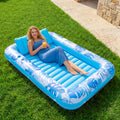 85 x 57-Inch Inflatable Pool Float Tanning Bed in Blue with Open Center, Ribbed Base and Raised Pillow — image 1