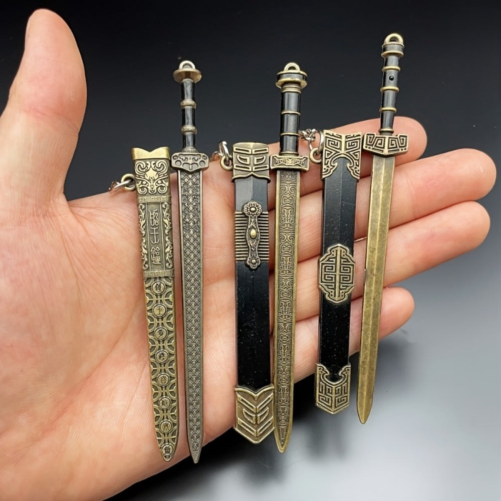 Seven-Piece Miniature Metal Sword Replica Set with Sheaths, Keychains and Ancient-Inspired Display Designs — image 8