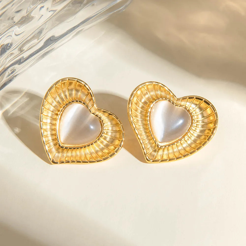 White cat eye stone earrings with niche temperament titanium steel earrings