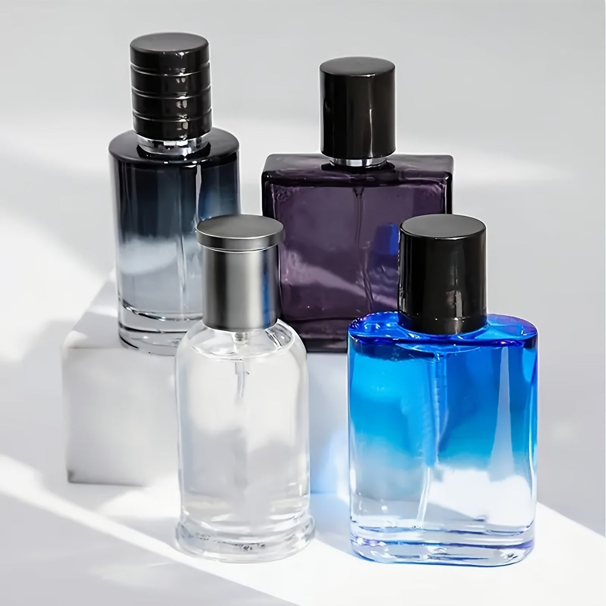 Four-Piece Boxed Fragrance Spray Set with Blue, Clear and Purple Gradient Bottle Presentation — image 10