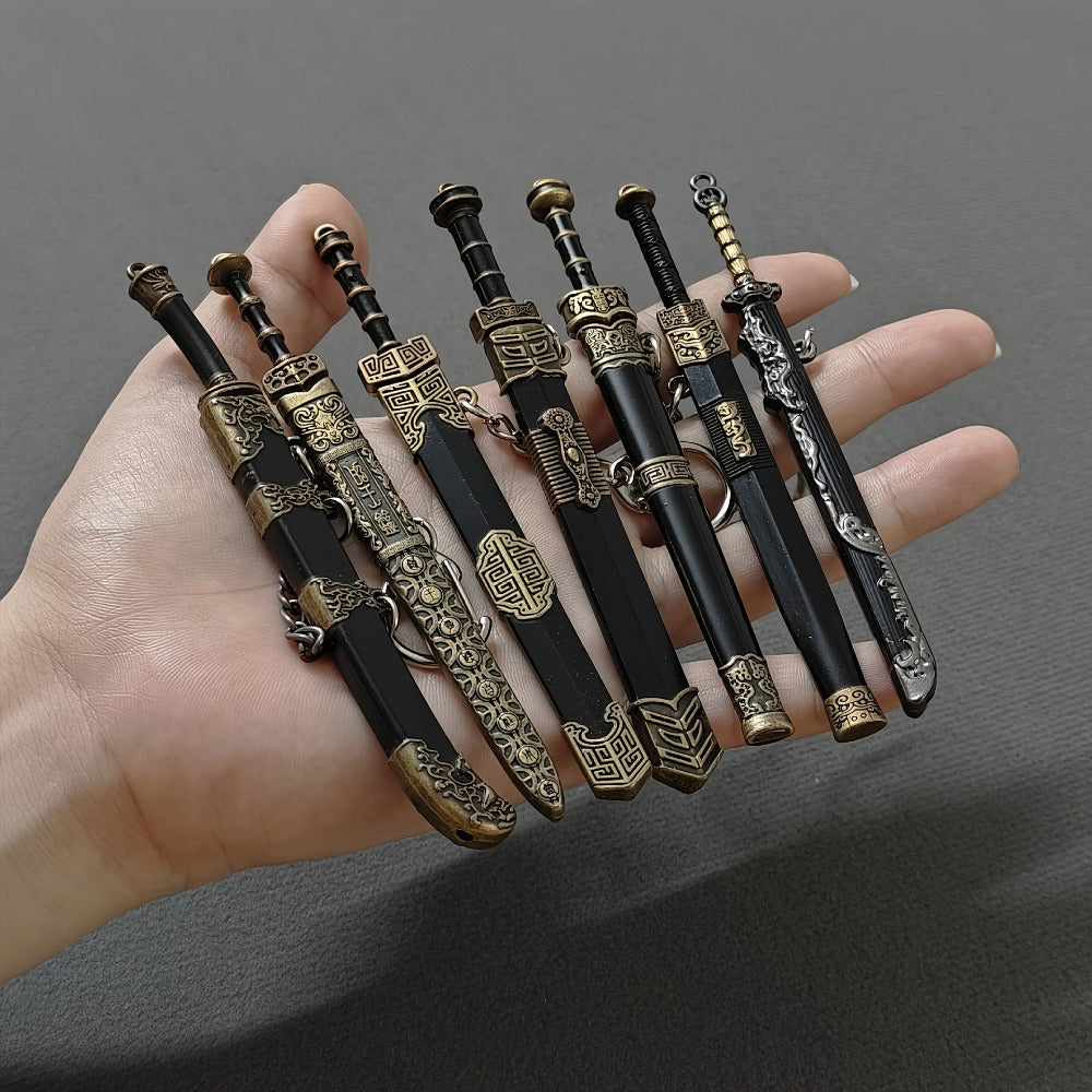 Seven-Piece Miniature Metal Sword Replica Set with Sheaths, Keychains and Ancient-Inspired Display Designs — image 1